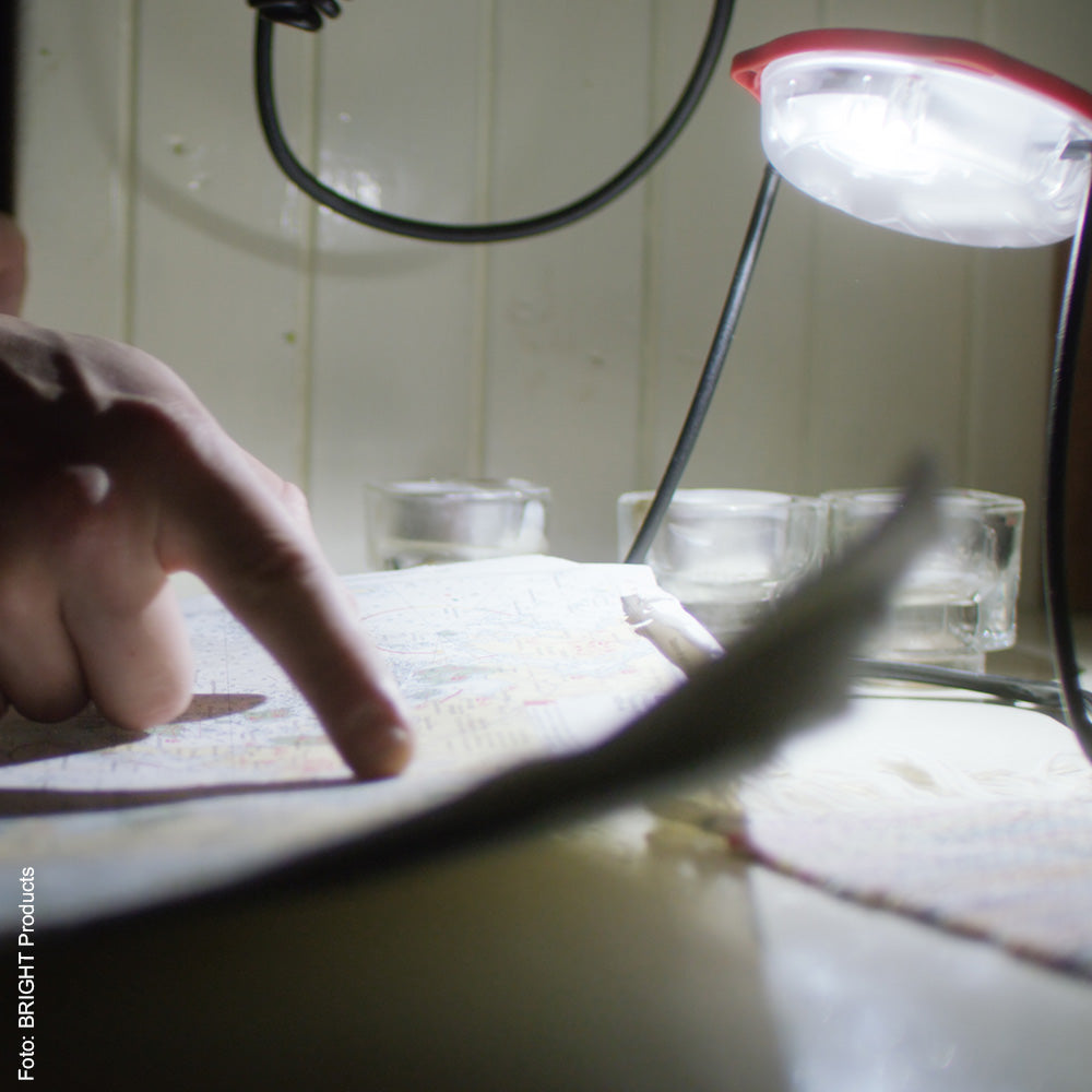 Solar lamp illuminating a map.