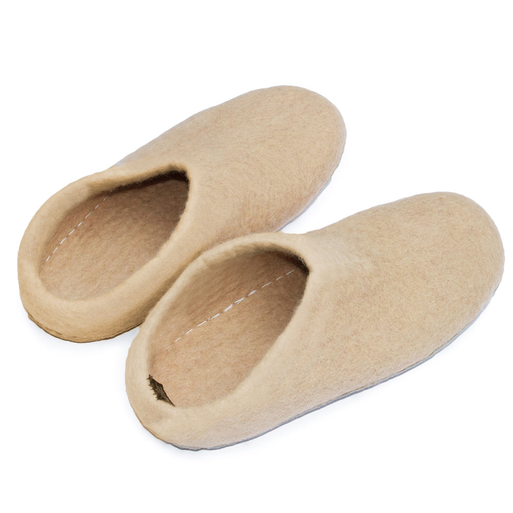 Beige slippers, closed at the back to mid-calf height.