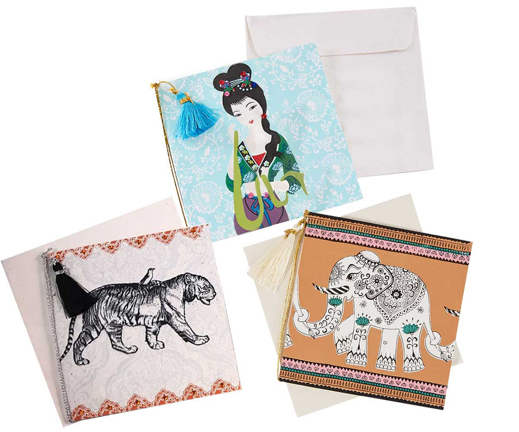 drei quadratische bunt bedruckte Karten, mit Tiger-Motiv, mit Elefant-Motiv und mit Japan-Motiv