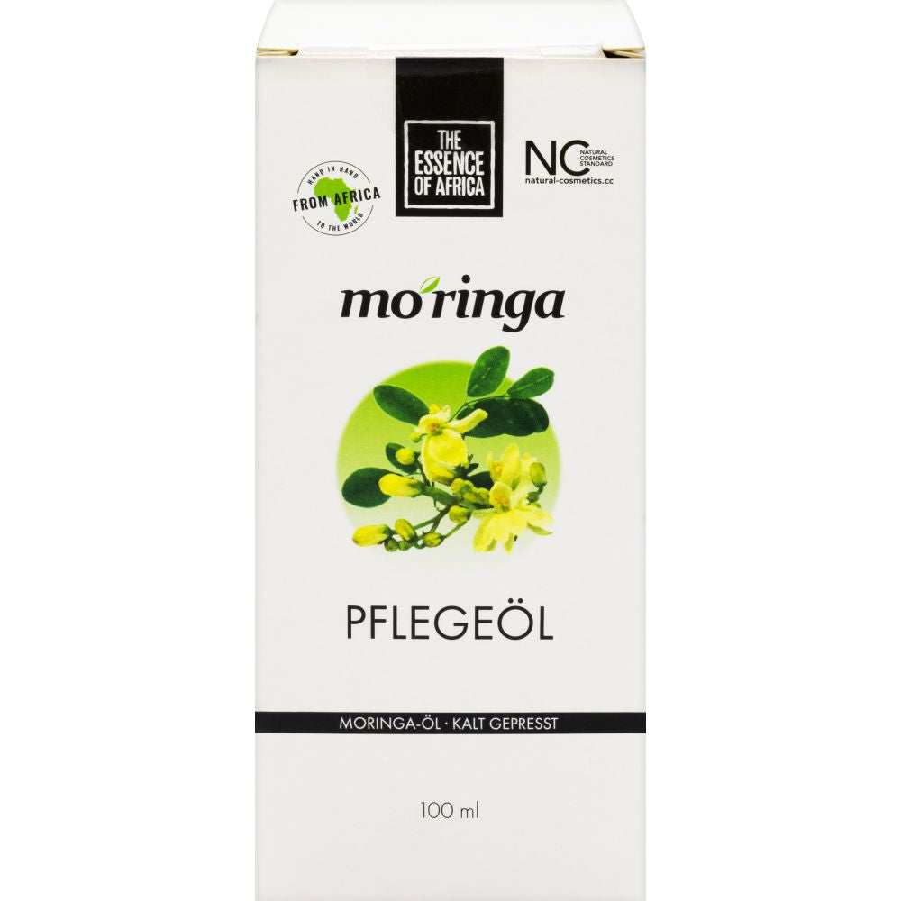 weiße Verpackund der Moringa Ölflasche, mittig ein Foto der Moringablüte 