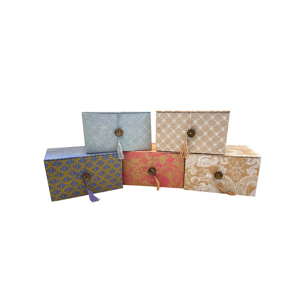 Five boxes with different patterns in different colours. Three next to each other, two in the middle above.
