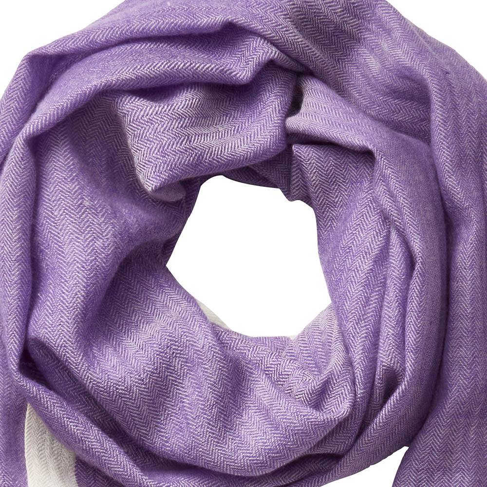 Close-up of the lilac-colored draped scarf. The herringbone weave pattern is clearly visible.
