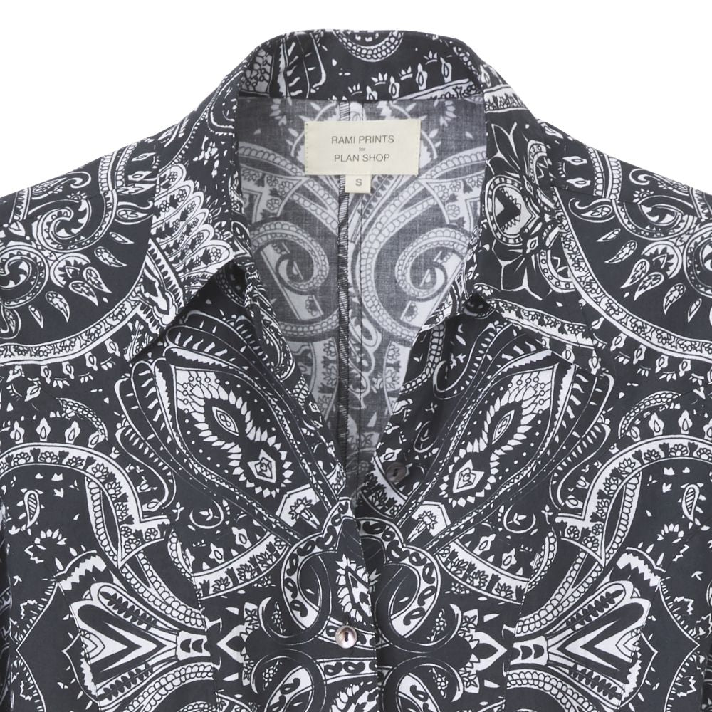 Close-up of the black blouse with white print