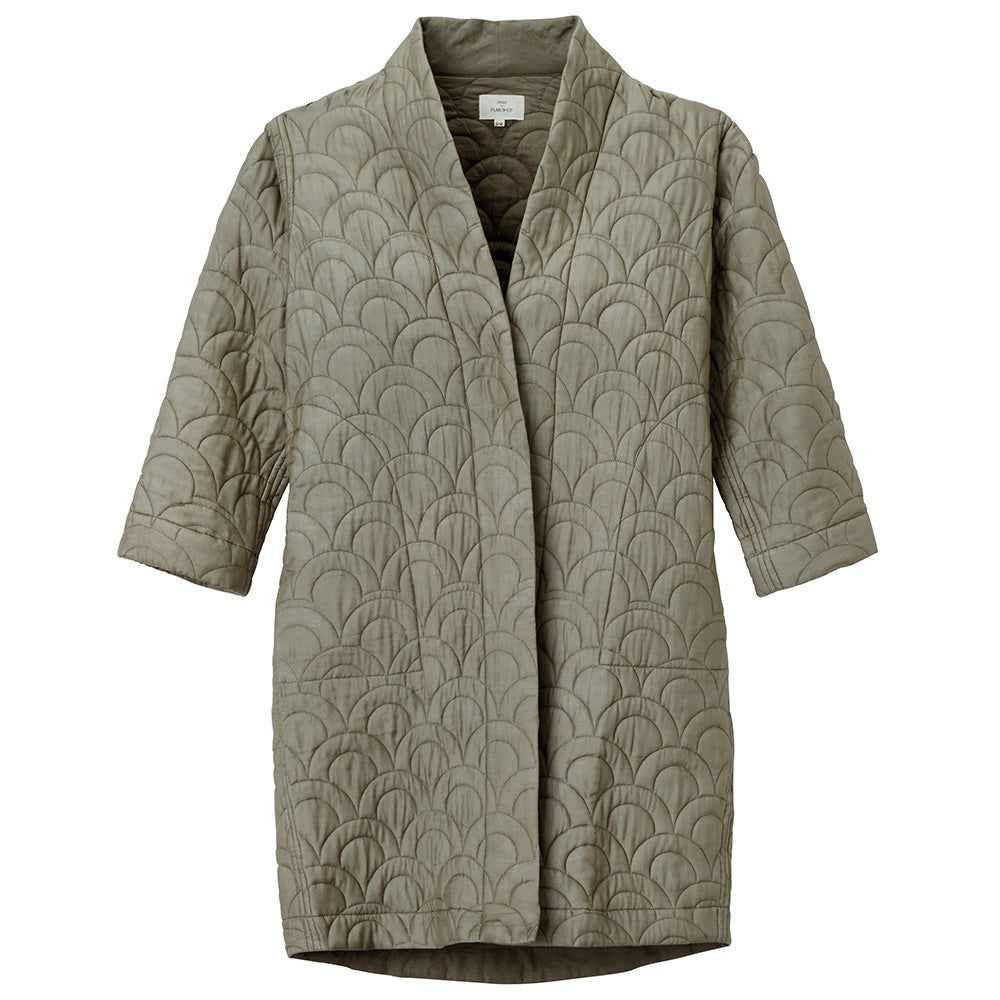Quilted coat, laid flat. The front panels are laid one on top of the other.