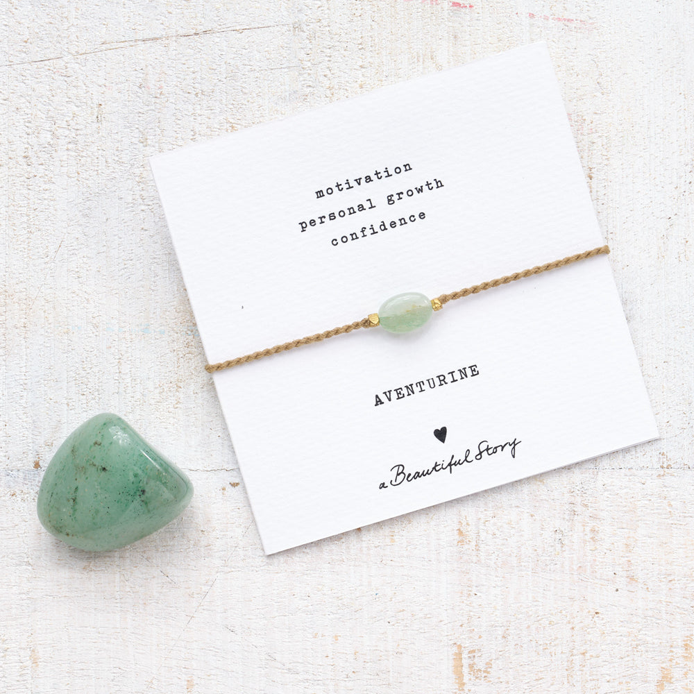 Card with aventurine bracelet and a larger aventurine stone next to it This makes it easier to recognise the stone look.