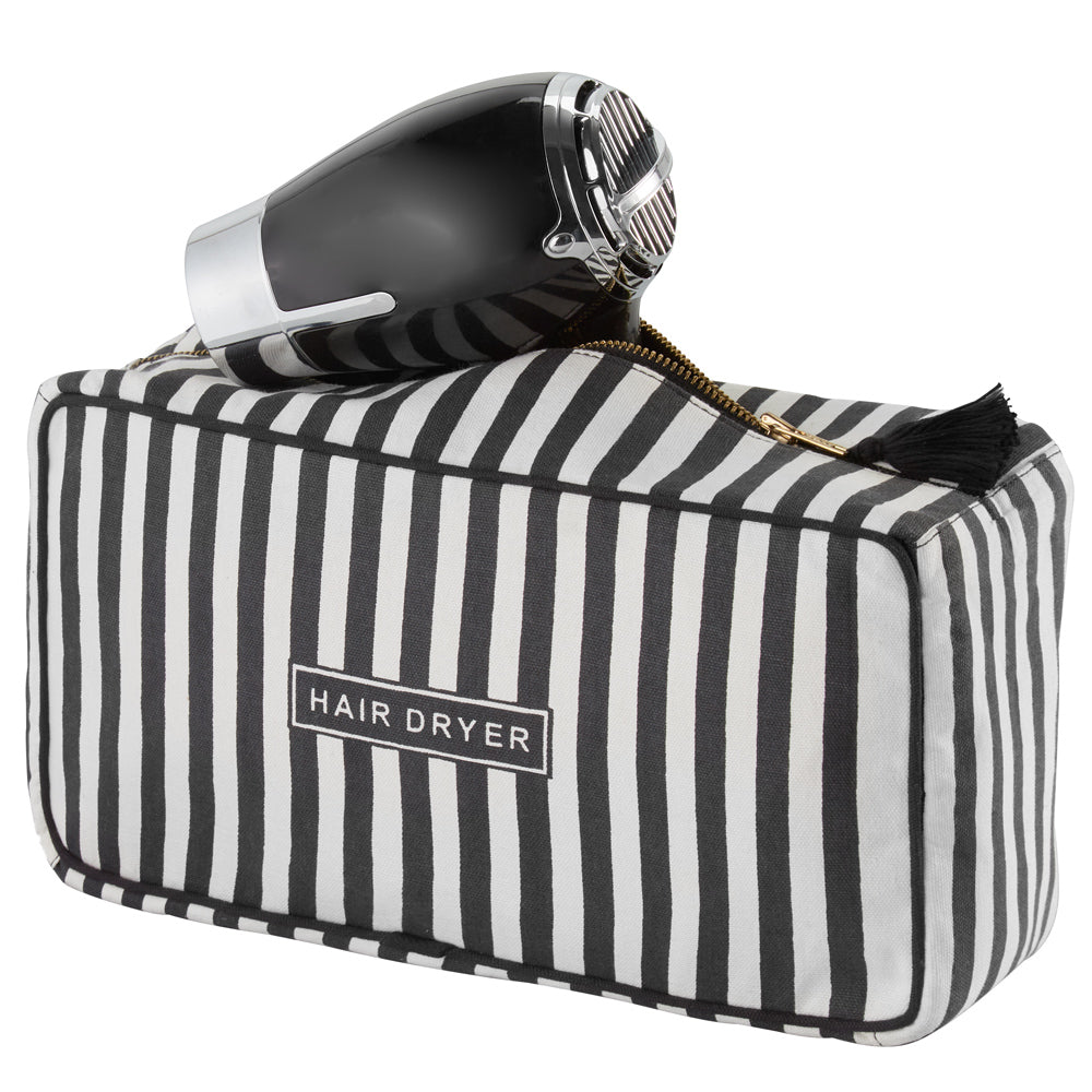 Toiletry bag with open zip and hairdryer protruding. Hairdryer not included in delivery.