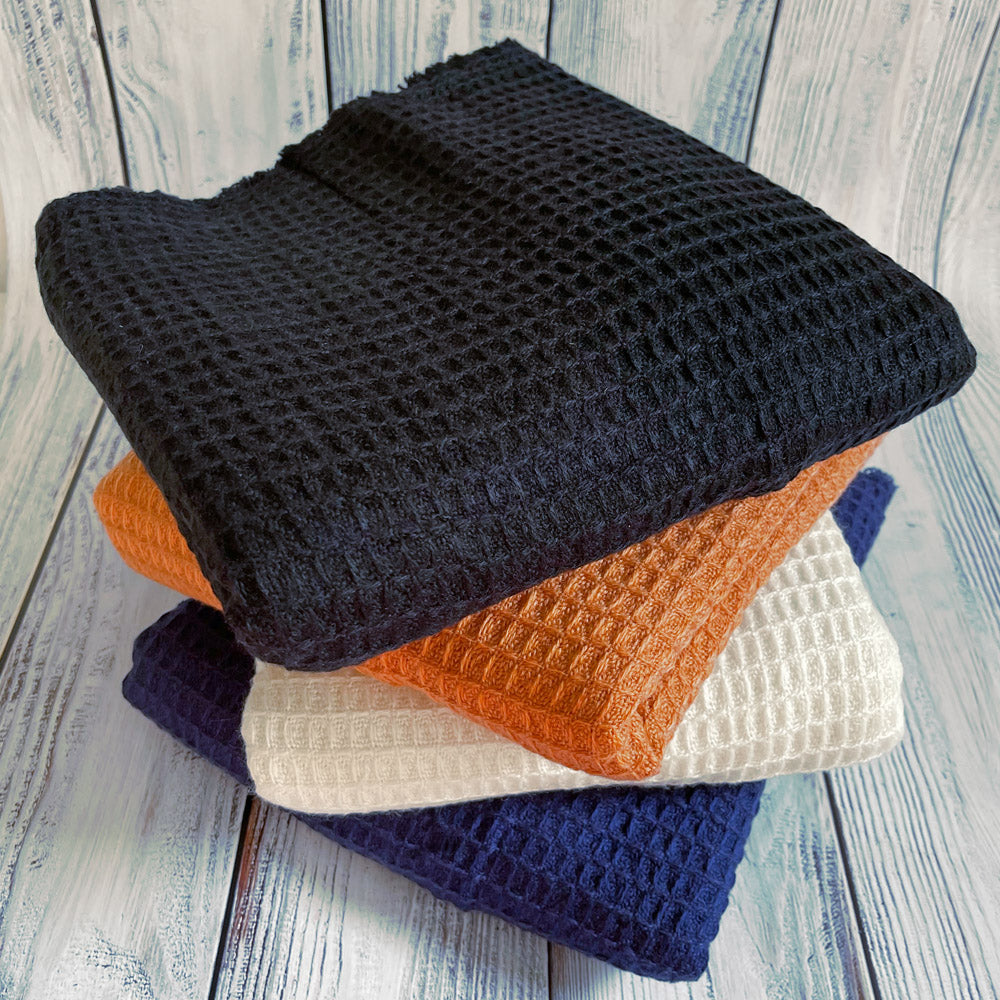 four different coloured scarves put together and on top of each other
