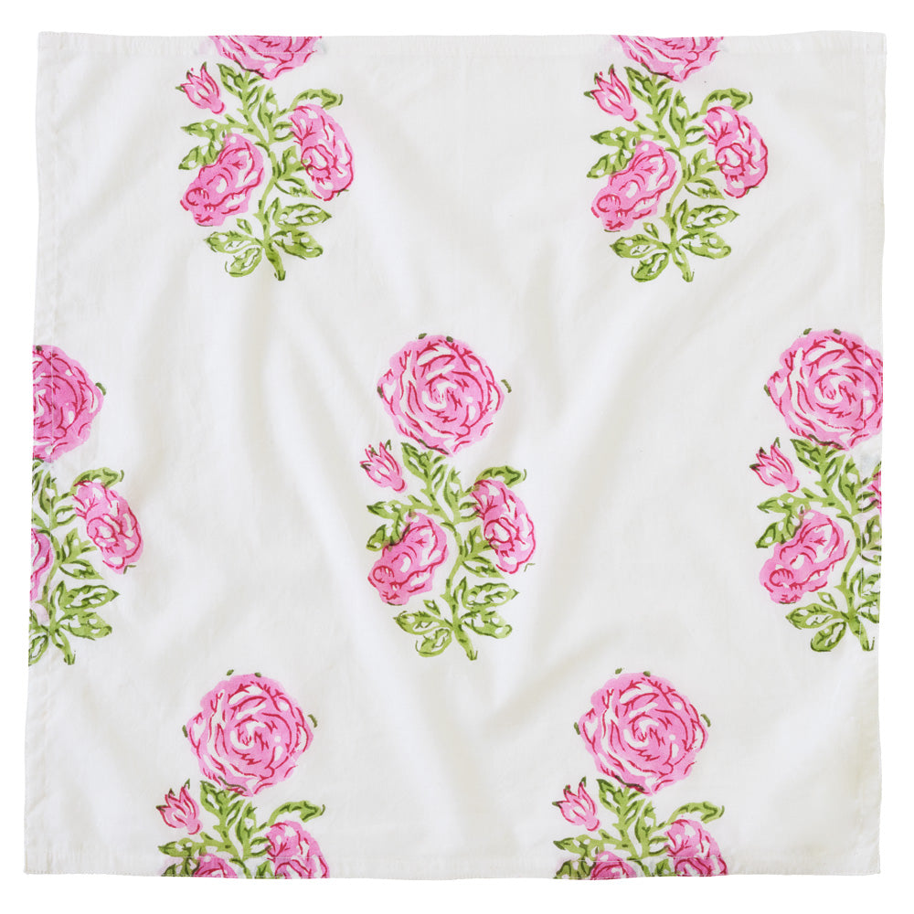 Square, flat napkin with rose print.