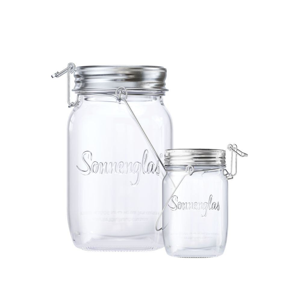 two unlit sun jars of different sizes