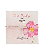 Rosenquarzarmband auf Grußkarte mit Blumenmotiv