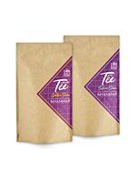 zwei braune Tütchen mit lila Etikett